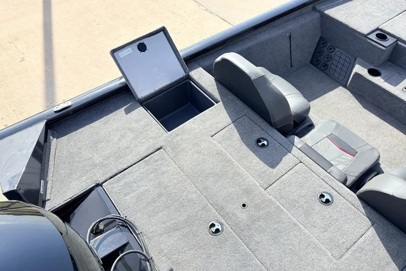 Slide: The Image of 2024 Tracker Pro Team 195 TXW Tournament Edition boat interior with storage compartments. - 38