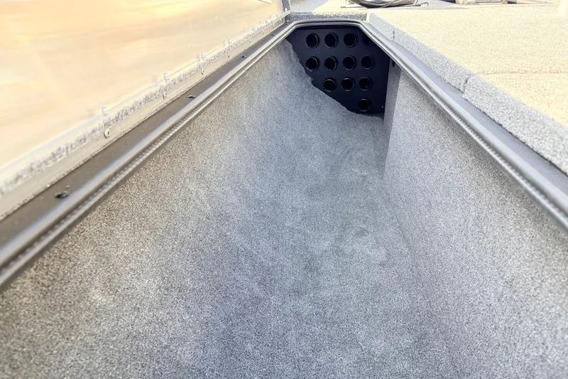 Slide: The Image of 2024 Tracker Pro Team 195 TXW Tournament Edition boat interior storage compartment. - 16