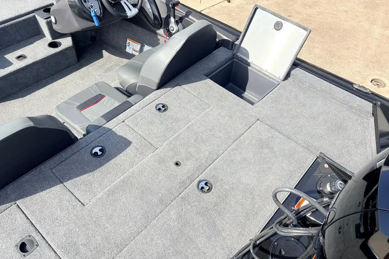 Slide: The Image of 2024 Tracker Pro Team 195 TXW Tournament Edition boat interior with seating and storage compartments. - 41