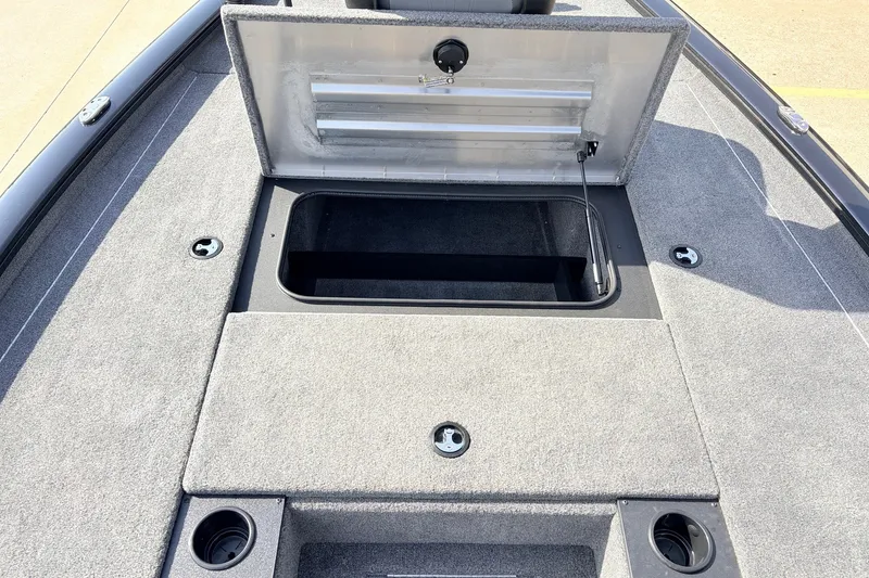 Slide: The Image of 2024 Tracker Pro Team 195 TXW Tournament Edition boat with open storage compartment on deck. - 17