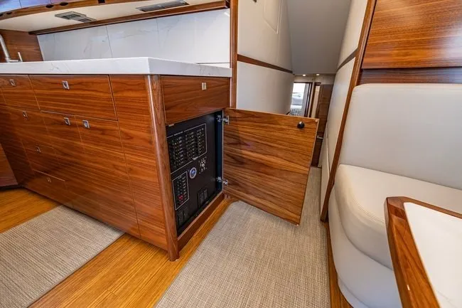 Slide: The Image of Luxurious interior of 2025 Viking 58 Convertible yacht with wood cabinetry and modern design. - 45