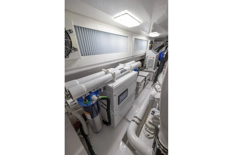 Slide: The Image of Engine room of 2025 Viking 58 Convertible yacht, showcasing advanced machinery and equipment. - 61