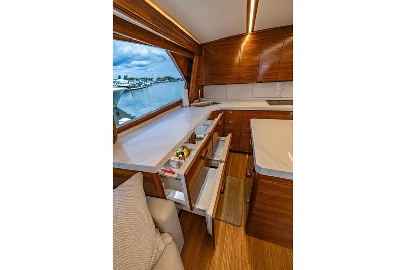 Slide: The Image of Luxurious interior of 2025 Viking 58 Convertible yacht with modern kitchen design. - 42