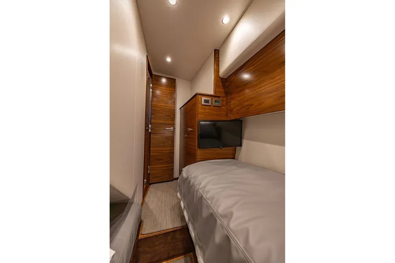 Slide: The Image of Luxurious cabin interior of 2025 Viking 58 Convertible yacht with wood accents and modern amenities. - 54