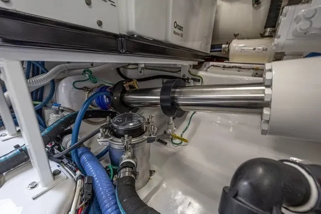 Slide: The Image of Engine room of 2025 Viking 58 Convertible yacht, showcasing mechanical components and wiring. - 62