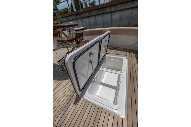 Slide: The Image of Open storage compartment on 2025 Viking 58 Convertible yacht deck. - 35