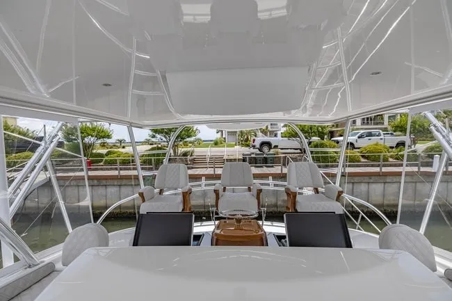 Slide: The Image of 2025 Viking 58 Convertible yacht interior with luxurious seating and modern design. - 22
