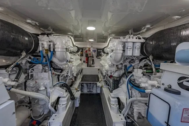 Slide: The Image of Engine room of 2025 Viking 58 Convertible yacht, showcasing advanced machinery and systems. - 56