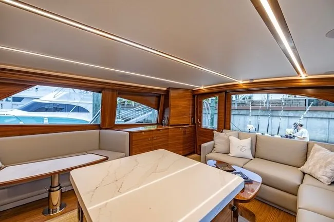 Slide: The Image of Luxurious interior of 2025 Viking 58 Convertible yacht with elegant seating and modern design. - 39