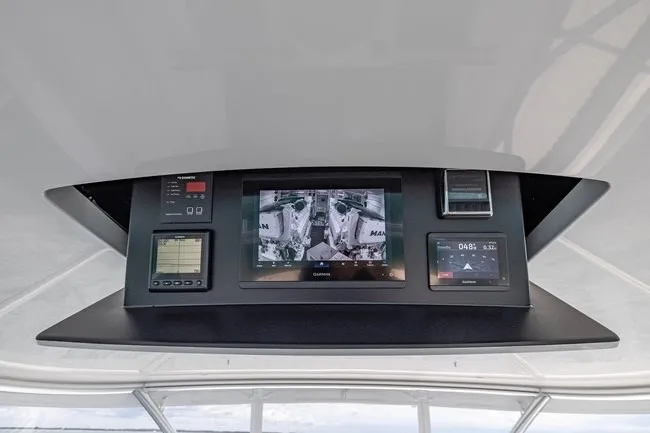 Slide: The Image of Control panel of 2025 Viking 58 Convertible yacht with advanced navigation displays. - 18