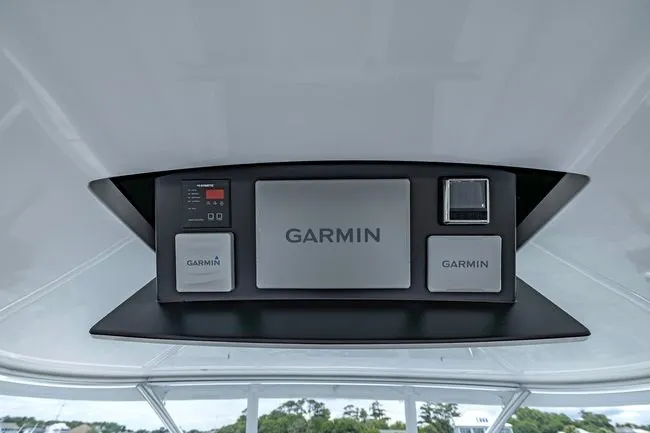 Slide: The Image of Garmin navigation system on 2025 Viking 58 Convertible yacht dashboard. - 19