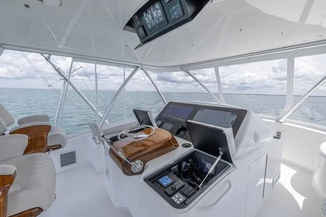Slide: The Image of Luxurious helm of 2025 Viking 58 Convertible yacht with advanced navigation systems. - 16