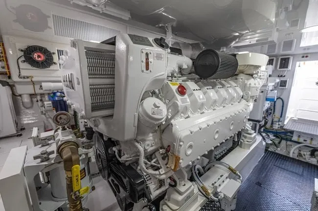 Slide: The Image of Engine room of 2025 Viking 58 Convertible yacht, featuring advanced machinery and equipment. - 58
