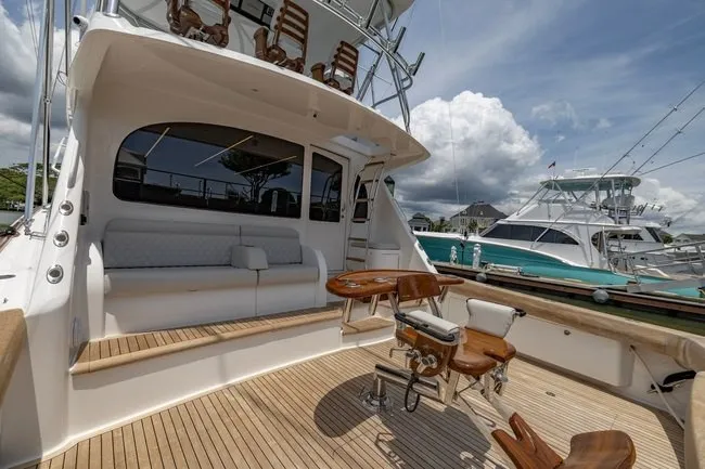 Slide: The Image of 2025 Viking 58 Convertible yacht with spacious deck and luxurious seating. - 2