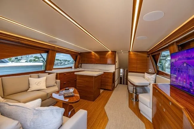 Slide: The Image of Luxurious interior of 2025 Viking 58 Convertible yacht with elegant wood finishes and modern amenities. - 3