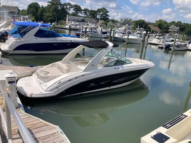 The Image of 2006 Chaparral 276 SSi boat docked in a marina on a sunny day. - 1