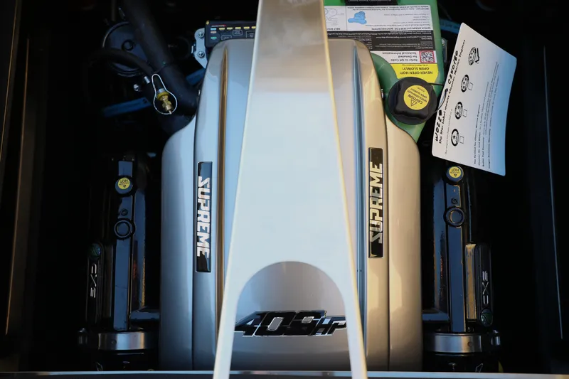 Slide: The Image of Engine compartment of 2026 Supreme S220 boat, featuring 409 horsepower engine. - 7