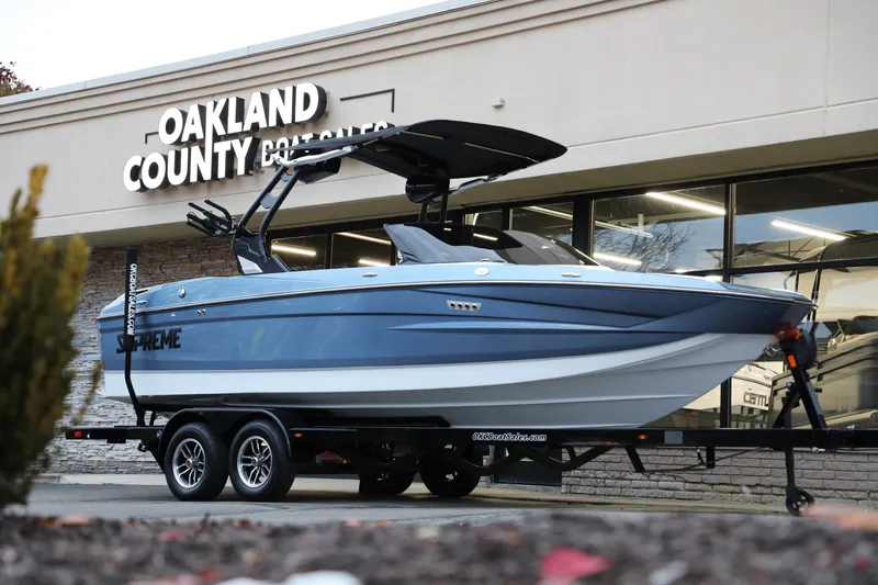 Slide: The Image of 2026 Supreme S220 boat displayed at Oakland County Boat Center. - 10
