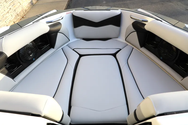 Slide: The Image of Luxurious interior of 2026 Supreme S220 boat with sleek white and black seating. - 4