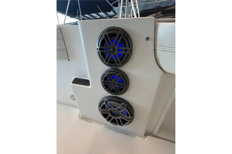 Slide: The Image of Speakers with blue LED lights on a 2013 Nor-Tech 340 Sport boat. - 22