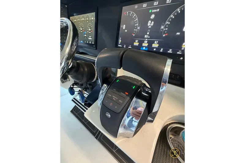 Slide: The Image of Control panel of a 2013 Nor-Tech 340 Sport boat with digital displays. - 21
