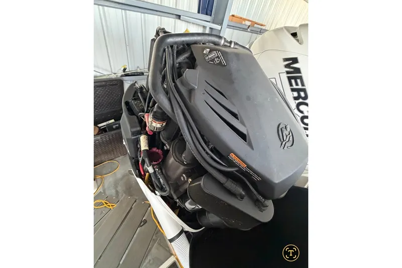 Slide: The Image of Engine of a 2013 Nor-Tech 340 Sport boat with Mercury branding visible. - 27