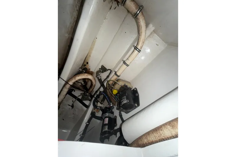 Slide: The Image of Bilge area of 2013 Nor-Tech 340 Sport boat showing hoses and pump system. - 8