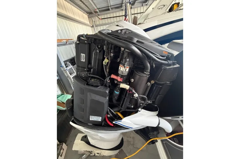 Slide: The Image of 2013 Nor-Tech 340 Sport outboard engine in a garage setting. - 28