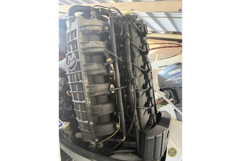 Slide: The Image of Close-up of a 2013 Nor-Tech 340 Sport engine, showcasing intricate mechanical details. - 29