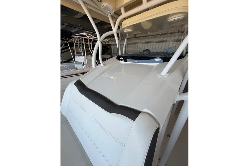 Slide: The Image of 2013 Nor-Tech 340 Sport boat, white exterior, stored indoors. - 9
