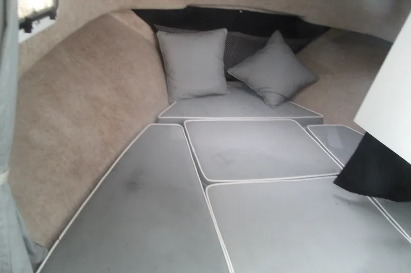 Slide: The Image of Interior cabin of 2016 Parker 2120 Sport Cabin boat with cushions and pillows. - 27