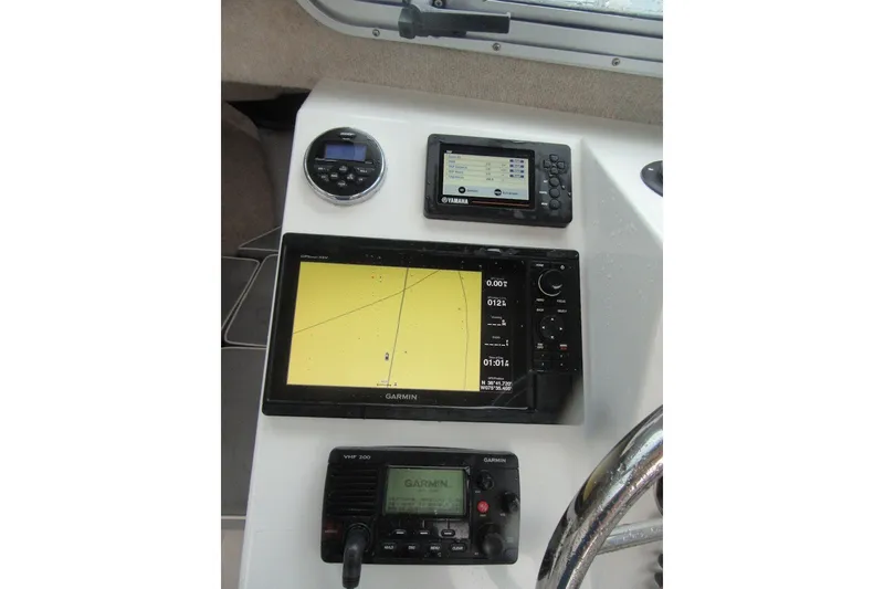 Slide: The Image of Dashboard of a 2016 Parker 2120 Sport Cabin with Garmin navigation equipment. - 25