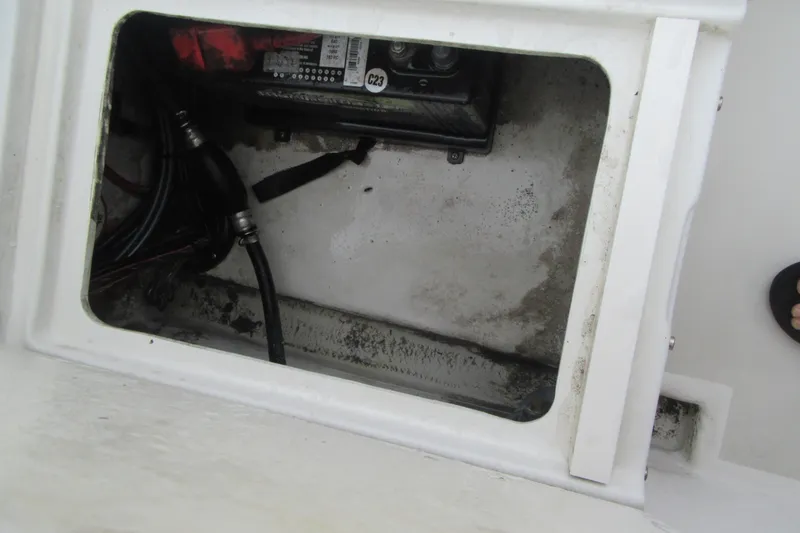 Slide: The Image of Battery compartment of a 2016 Parker 2120 Sport Cabin boat, showing wiring and connections. - 15