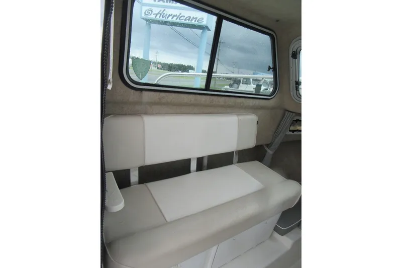 Slide: The Image of Interior of 2016 Parker 2120 Sport Cabin with cushioned seating and window view. - 22