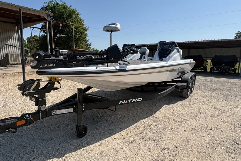 The Image of 2027 Nitro Z20 XL Pro boat on trailer, featuring Garmin equipment, parked outdoors. - 0