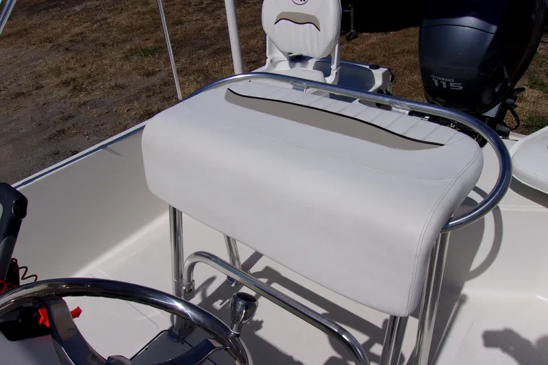 Slide: The Image of 2010 Key West 196 Bay Reef boat interior with white seating and Yamaha 115 engine. - 6