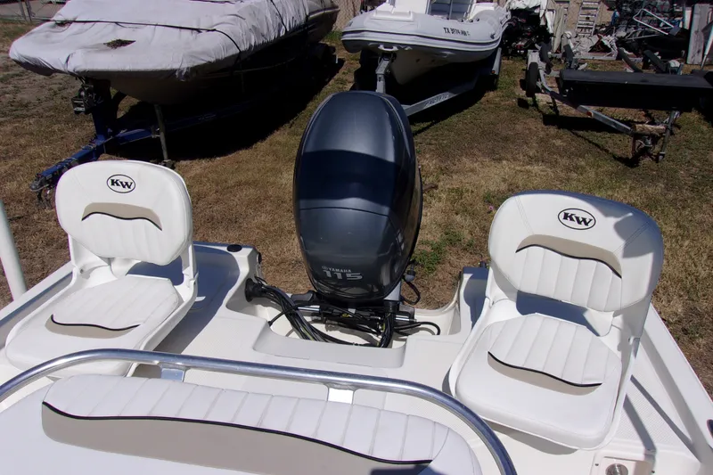 Slide: The Image of 2010 Key West 196 Bay Reef boat with Yamaha engine and cushioned seating. - 7