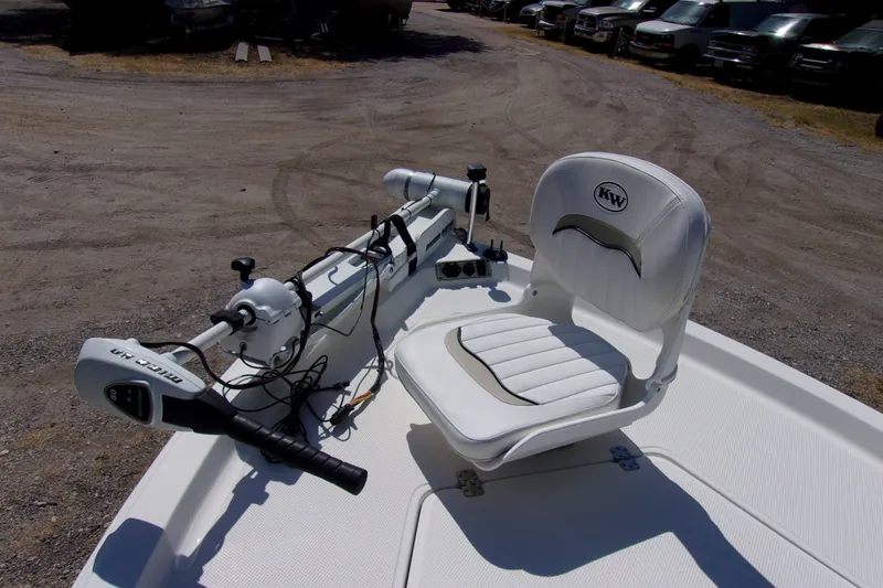 Slide: The Image of 2010 Key West 196 Bay Reef boat with white seating and trolling motor. - 11