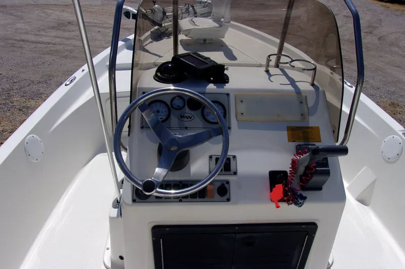 Slide: The Image of 2010 Key West 196 Bay Reef boat console with steering wheel and controls. - 5