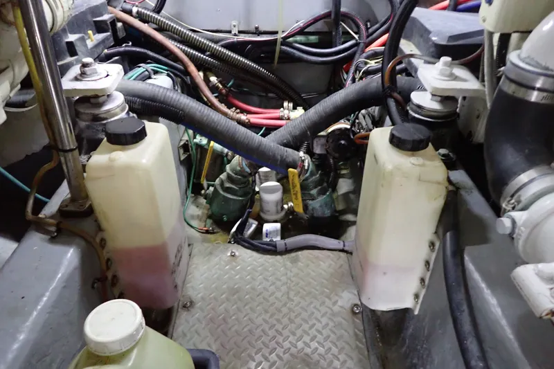 Slide: The Image of Engine room of a 1998 Sea Ray 480 Sedan Bridge with visible components and wiring. - 197
