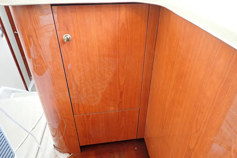 Slide: The Image of Wooden cabinet detail on 1998 Sea Ray 480 Sedan Bridge yacht interior. - 114