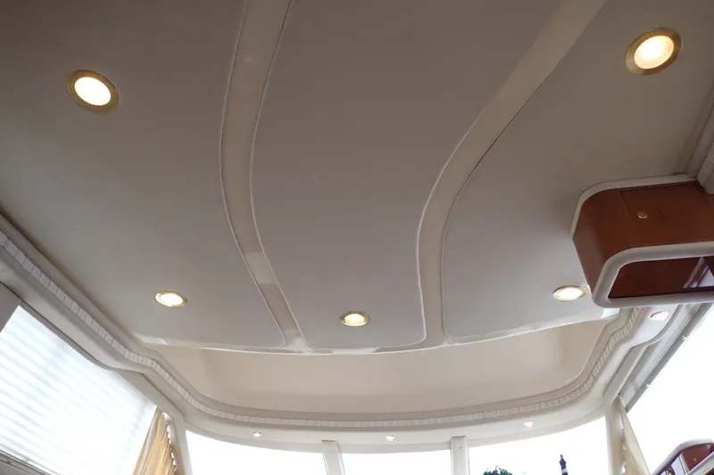 Slide: The Image of Interior ceiling of a 1998 Sea Ray 480 Sedan Bridge yacht with recessed lighting. - 136