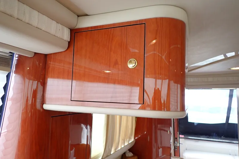 Slide: The Image of Interior of 1998 Sea Ray 480 Sedan Bridge with polished wood cabinetry. - 120