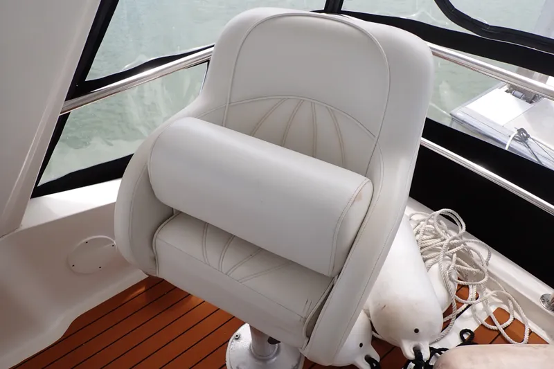 Slide: The Image of Captain's chair on 1998 Sea Ray 480 Sedan Bridge yacht, with ropes and fenders nearby. - 56