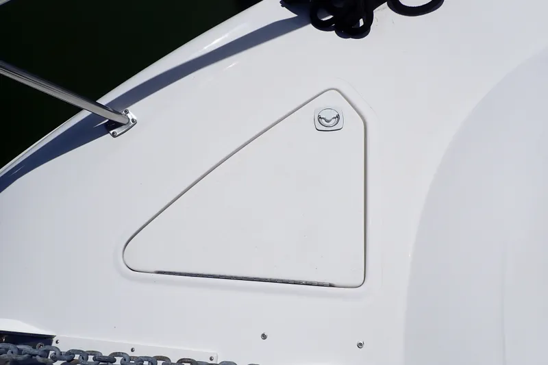 Slide: The Image of Hatch on 1998 Sea Ray 480 Sedan Bridge boat deck, featuring sleek design and metal fittings. - 95