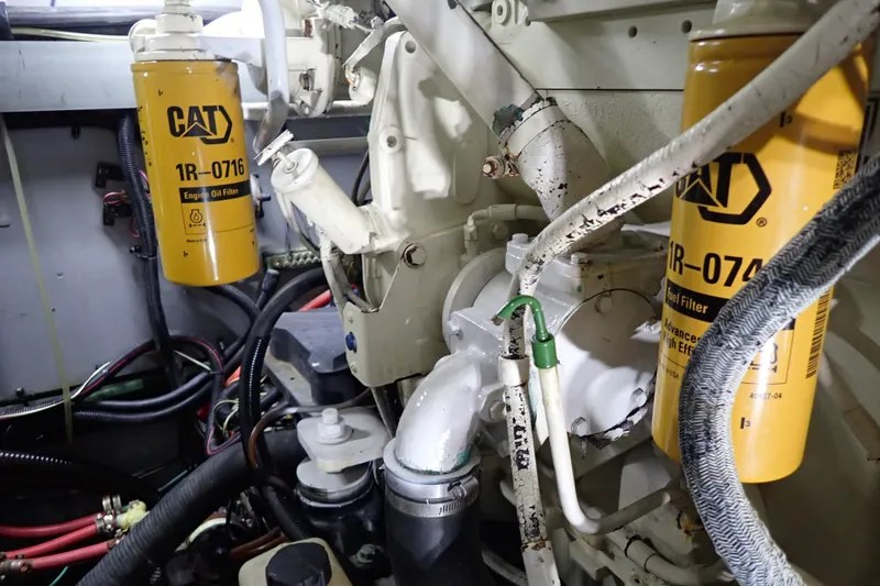 Slide: The Image of Engine compartment of a 1998 Sea Ray 480 Sedan Bridge with CAT oil filters. - 201
