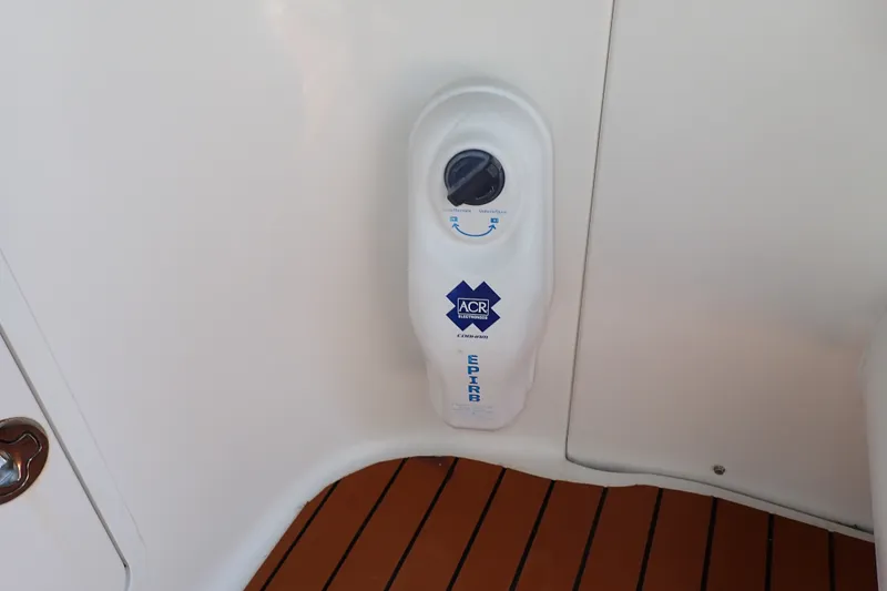 Slide: The Image of ACR EPIRB mounted on 1998 Sea Ray 480 Sedan Bridge yacht interior. - 68
