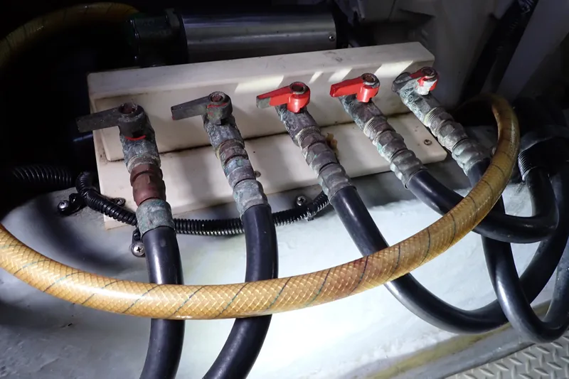 Slide: The Image of Engine room valves and hoses on a 1998 Sea Ray 480 Sedan Bridge yacht. - 193