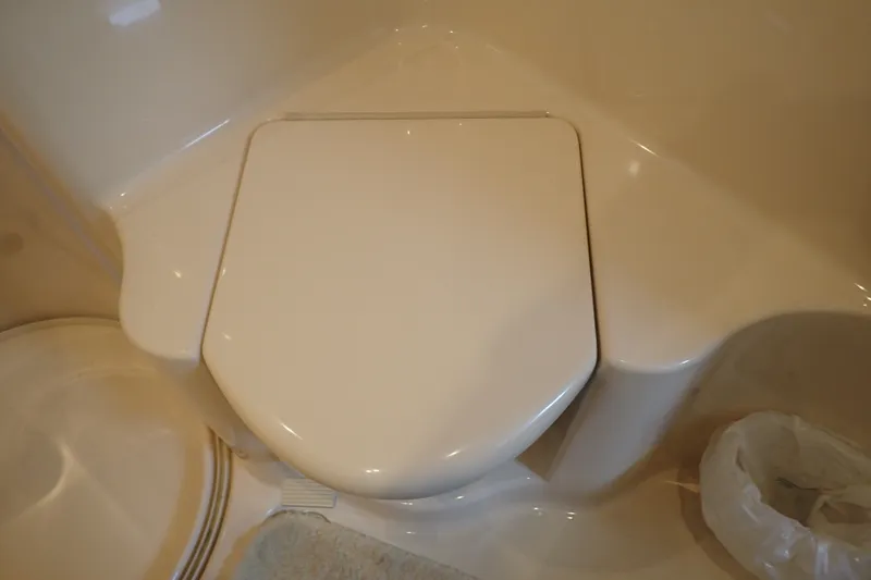 Slide: The Image of Toilet seat in 1998 Sea Ray 480 Sedan Bridge yacht bathroom. - 181