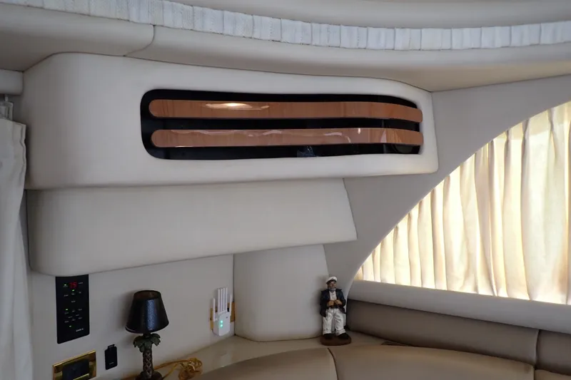 Slide: The Image of Interior of 1998 Sea Ray 480 Sedan Bridge yacht with elegant seating and decor. - 135
